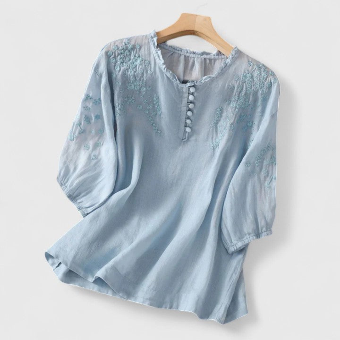 Delilah – Linen Blouse with Embroidered Ruffle Collar and Pom-Poms