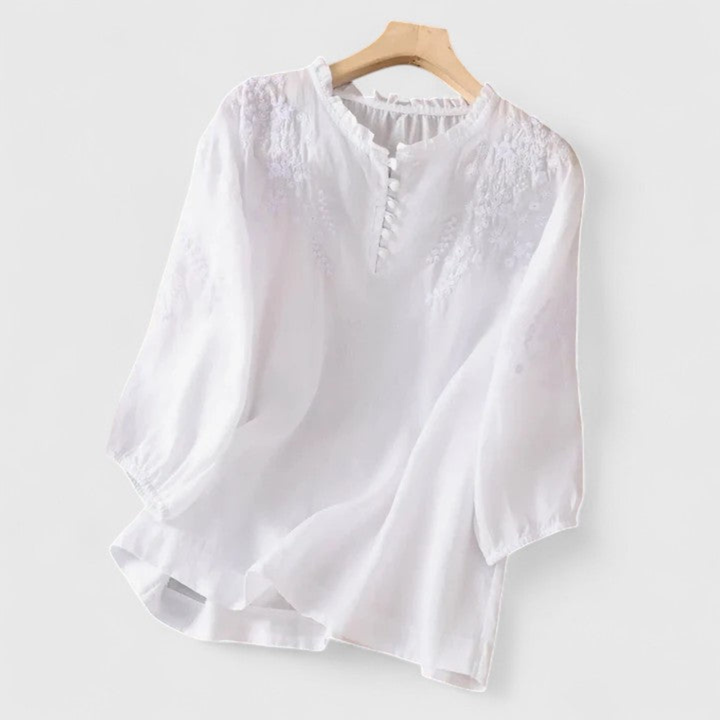 Delilah – Linen Blouse with Embroidered Ruffle Collar and Pom-Poms